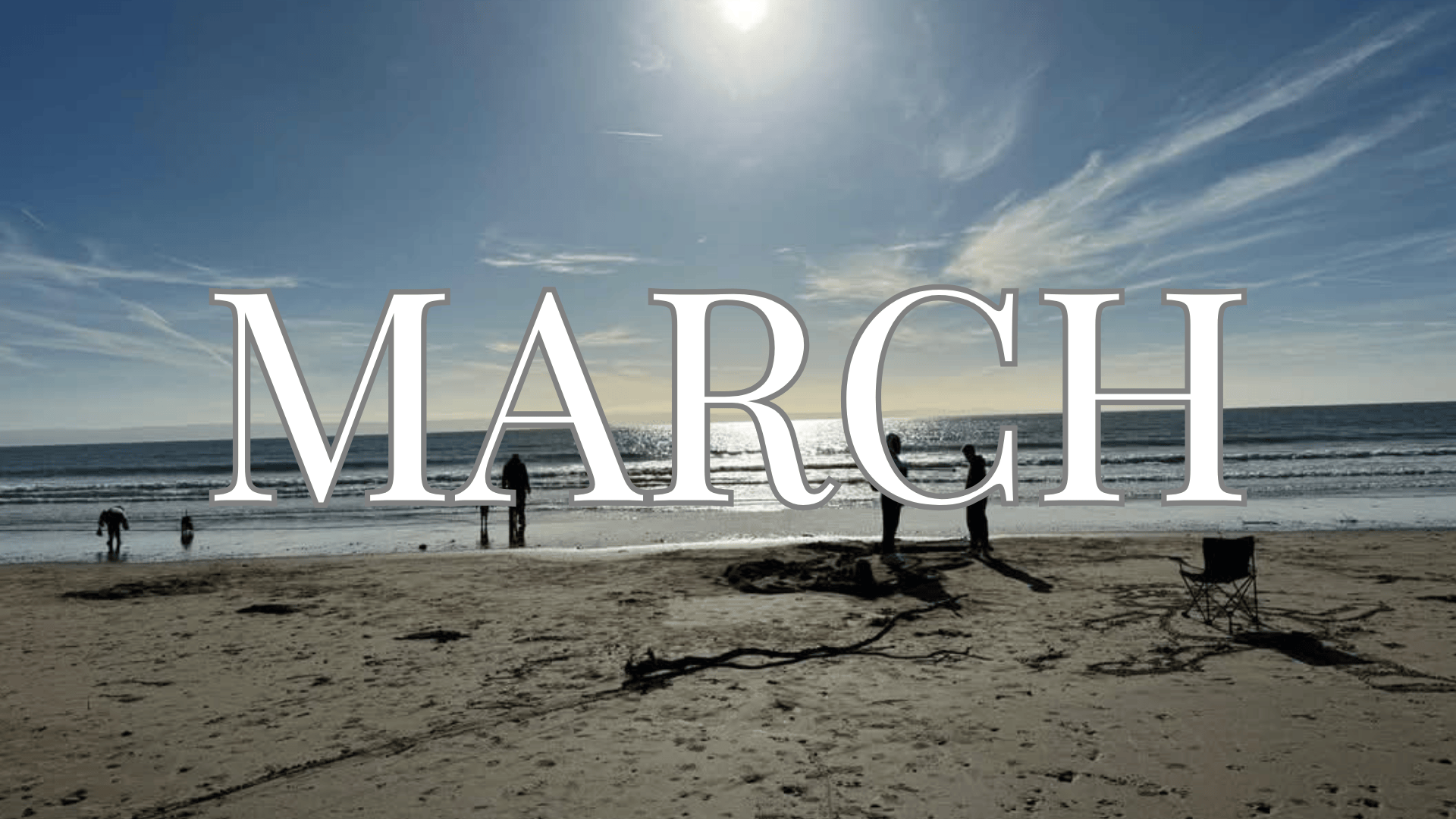 The word March overlayed on an Image of Trecco Bay beach