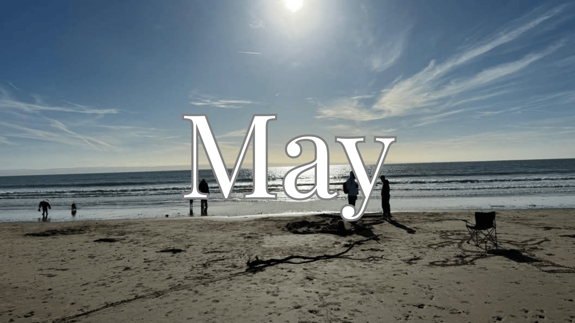 The word May overlayed on an image of Trecco beach