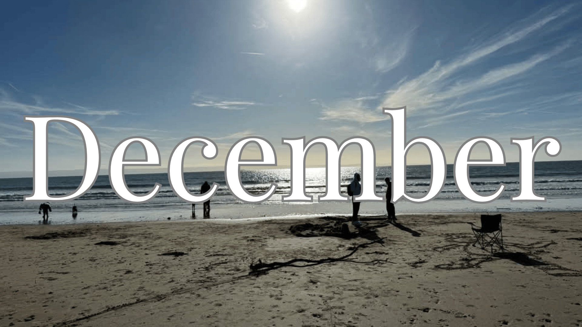 The word December overlayed on an image of Trecco bay beach